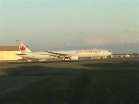 Air Canada 77W departs YUL on 24R .